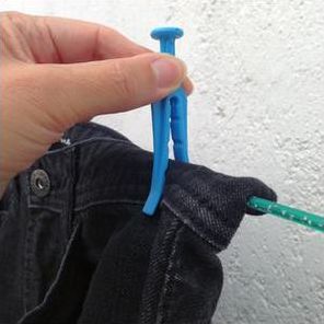 Using a plastic clothes peg on jeans